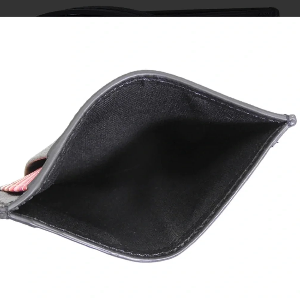 Check out Paul Smith!!Black Textured Leather card holder. NWOT.  Men or women’s